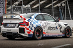 Exterior view of Alpha N G87 M2 Class 3 Wing Gurney Flap set installed on a vehicle, highlighting aerodynamic enhancement.