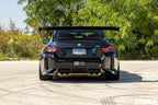 Alpha N G87 M2 GT3 Swan Neck rear wing installed on the exterior of a car, showcasing its aerodynamic design and mounting details.