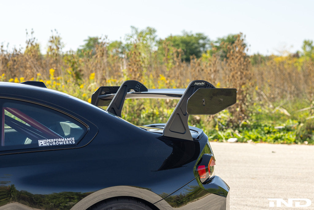 Alpha N Corse Swan Neck Rear Wing installed on a car, showcasing aerodynamic exterior racing wing with sleek design.