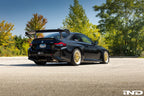 Alpha N Corse Swan Neck Rear Wing installed on a car, showcasing its aerodynamic design and sleek exterior finish.
