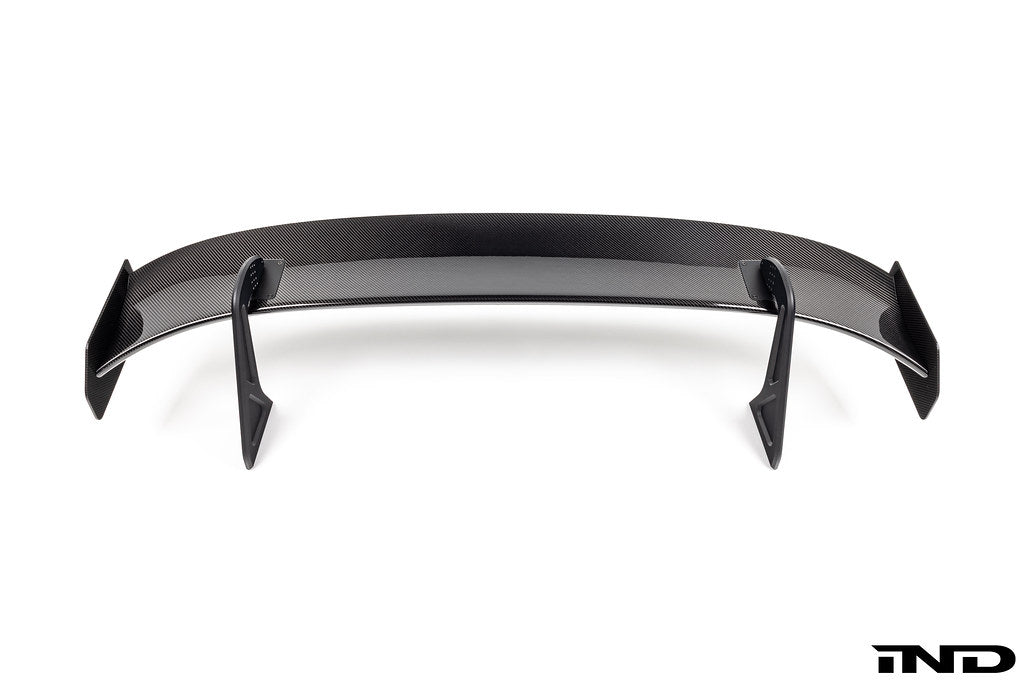 White Alpha N Corse Swan Neck Rear Wing mounted on a car, showcasing its aerodynamic design and sleek exterior style.