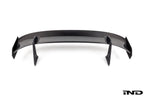 White Alpha N Corse Swan Neck Rear Wing mounted on a car, showcasing its aerodynamic design and sleek exterior style.