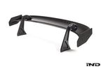 White Alpha N Corse Swan Neck Rear Wing mounted on a car, showcasing its aerodynamic design and sleek exterior style.