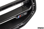 Alpha N G87 M2 LCI front grille emblem retainer with BMW OEM M2 badge installed on the vehicle exterior.