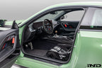 Interior view of the Alpha N G87 M2 Motorsport door pull kit installed, showcasing sleek design and high-quality finish.