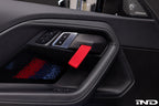 Alpha N G87 M2 Motorsport interior door pull kit installed, featuring sleek design and high-quality materials for enhanced grip.