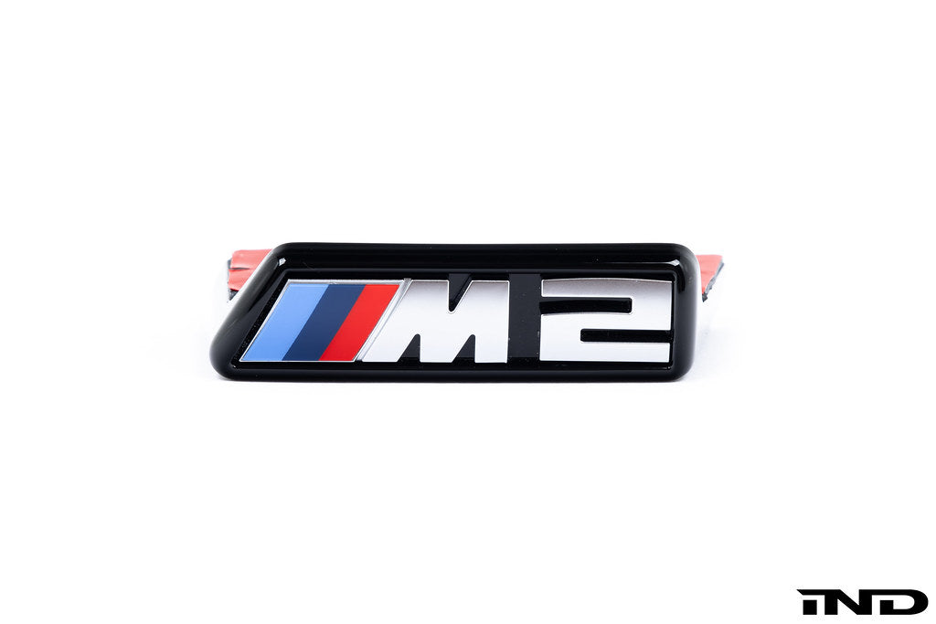 Alpha N G87 M2 front grille emblem retainer for Pre-LCI models, shown on white background. Exterior car part.