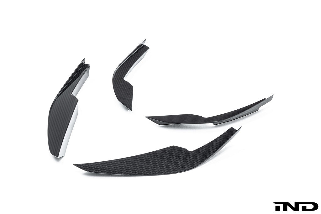 Alpha-N G8X M3 M4 carbon canard set installed on vehicle, showing aerodynamic exterior enhancements in white background.