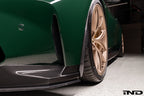 Alpha N G8X M3 M4 carbon exterior aeroblades installed on front spoiler for sporty aerodynamic performance.