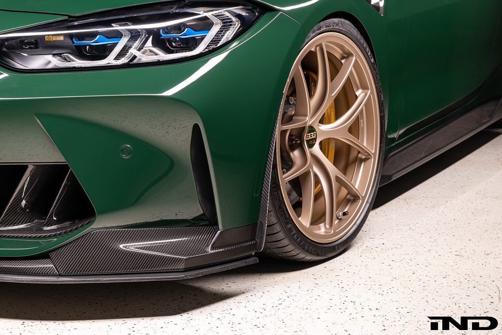 Alpha N G8X M3 M4 carbon aeroblades installed on front spoiler for exterior enhancement.