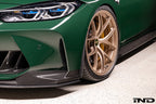 Alpha N G8X M3 M4 carbon aeroblades installed on front spoiler for exterior enhancement.