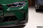 Alpha N G8X M3 M4 carbon aeroblades installed on front spoiler for exterior enhancement of BMW M series vehicles.