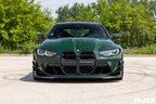 Alpha N G8X M3 M4 carbon front spoiler installed on exterior of vehicle, showcasing sleek aerodynamic design.