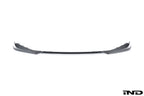 Alpha-N G8X M3 M4 carbon front spoiler mounted on a white background, showcasing its sleek exterior design.