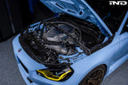 Alpha N G8X S58 carbon engine cover installed on BMW M2 M3 M4, exterior view showing sleek carbon finish and fitment