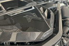 Alpha N G8X S58 carbon engine cover installed on exterior of M2, M3, or M4 BMW with sleek black carbon fiber finish.