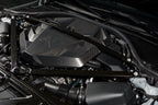 Installed Alpha N G8X S58 Carbon Engine Cover on BMW M2, M3, or M4 showing sleek black carbon fiber exterior design.