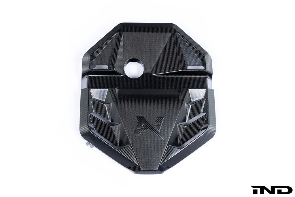 Alpha N G8X S58 carbon engine cover installed on a BMW G8X M2, M3, or M4, shown against a white background.