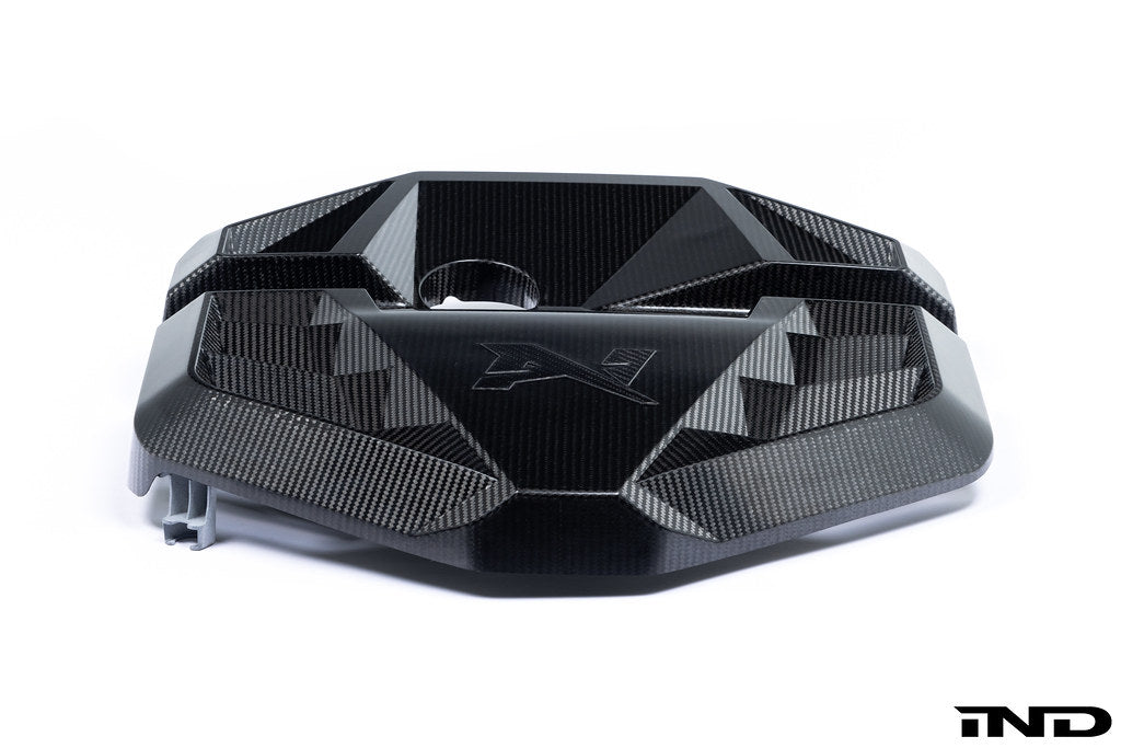 Alpha N G8X S58 carbon engine cover mounted on a white background, showcasing its sleek exterior design for M2, M3, and M4 models.