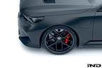 Alpha N G90 G99 M5 carbon front corner splitter set installed, showing sleek black aerodynamic exterior design with splitters on a car.