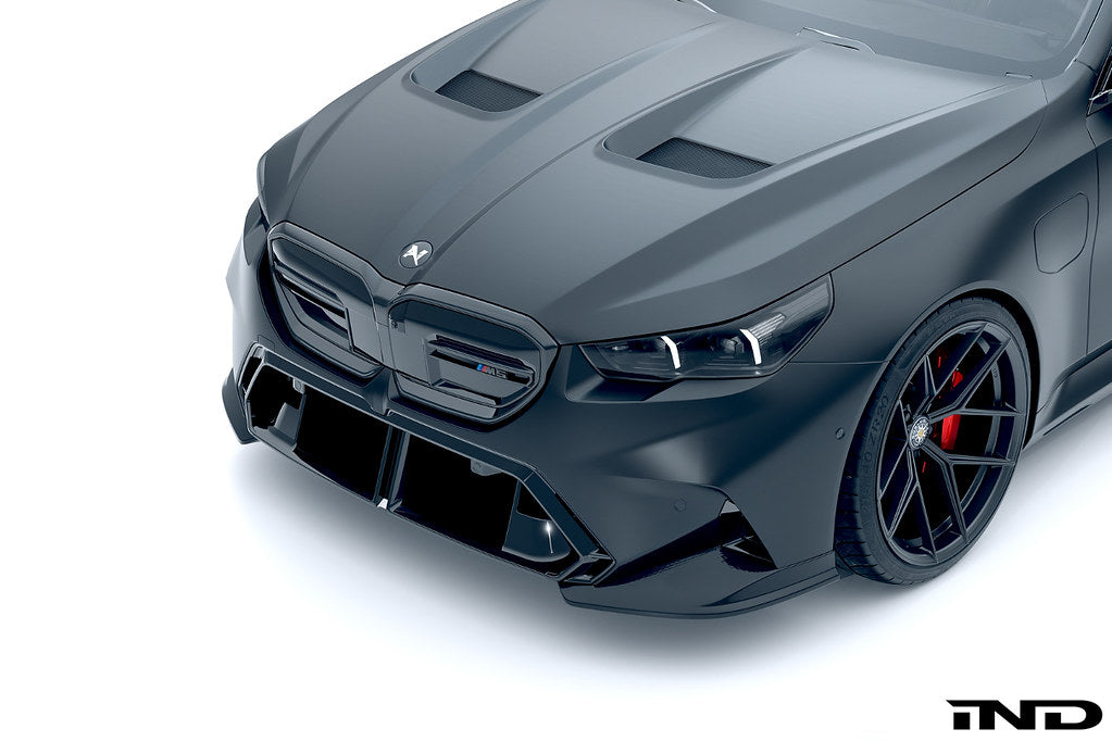 Alpha N G90 G99 M5 carbon front corner splitter set installed on a vehicle's front corners, showcasing sleek aerodynamic design.