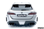 Alpha N G90 G99 M5 carbon rear diffuser installed on vehicle, showcasing sleek exterior design and aerodynamic features.