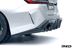 Alpha N G90 G99 M5 carbon rear diffuser installed on exterior of vehicle, showcasing sleek aerodynamic design and carbon fiber finish.