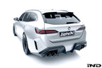 Alpha N G90 G99 M5 carbon rear diffuser installed on the vehicle, showcasing its sleek, aerodynamic exterior design.