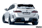 Alpha N G90 G99 M5 carbon rear diffuser installed on vehicle, showcasing sleek aerodynamic exterior design.