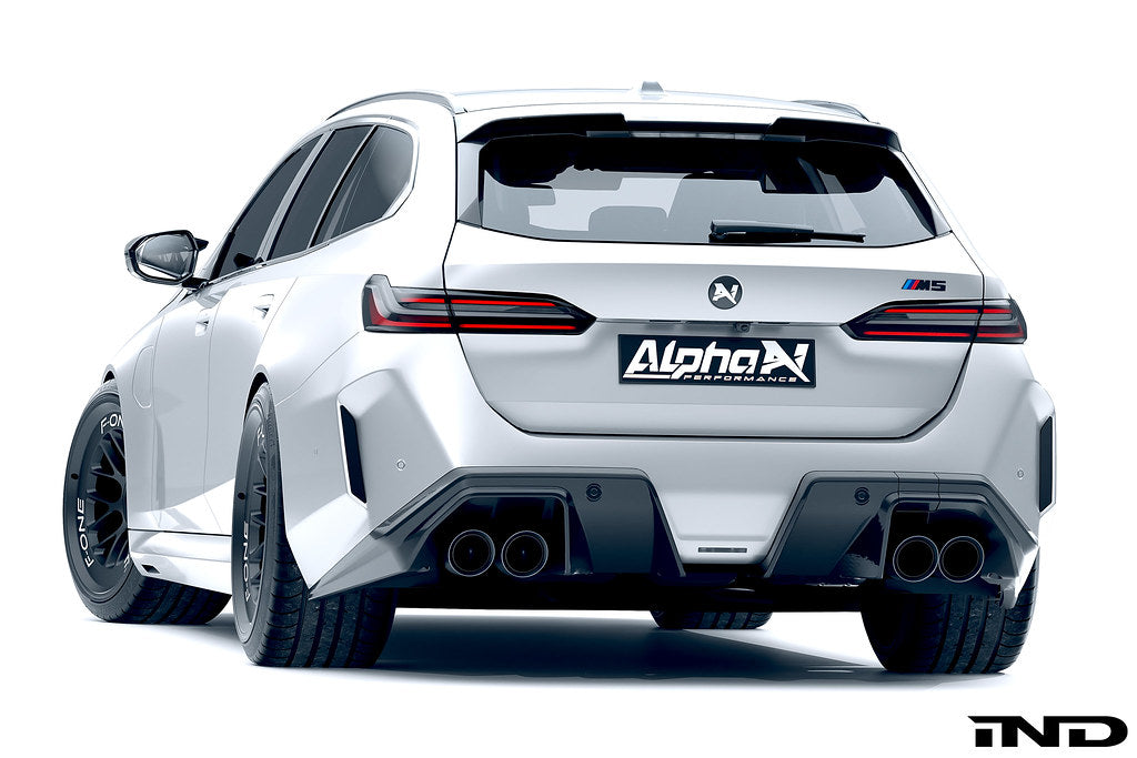 Alpha N G90 G99 M5 carbon rear diffuser installed on vehicle, showcasing sleek aerodynamic exterior design.