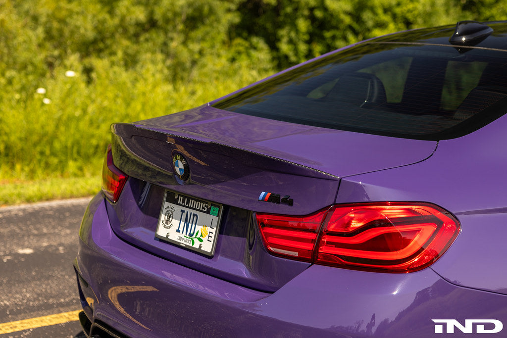 RKP Alpha-N F82 M4 carbon trunk installed on exterior of BMW F82 M4, showcasing sleek lightweight carbon fiber design.