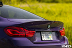 RKP Alpha-N F82 M4 carbon trunk installed on exterior of car, showcasing sleek, lightweight carbon fiber design.