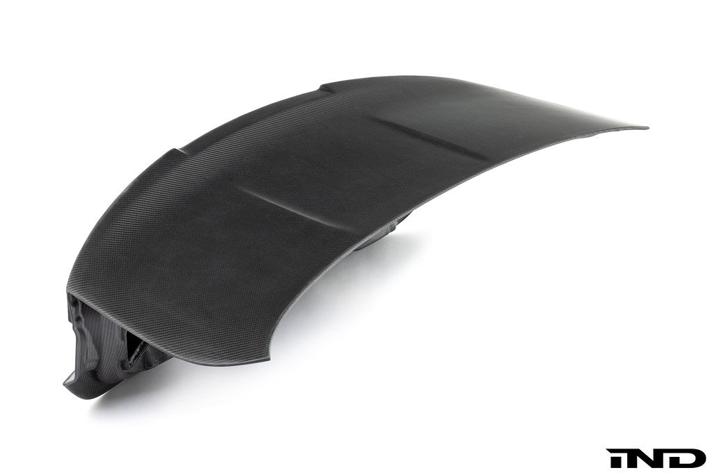 RKP Alpha-N F82 M4 carbon trunk exterior with white background, showcasing sleek lightweight design and premium carbon fiber finish.