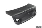 RKP Alpha-N F82 M4 carbon trunk exterior with white background, showcasing sleek aerodynamic design and lightweight carbon fiber material.