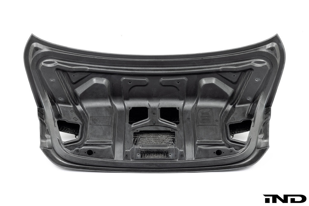 RKP Alpha-N F82 M4 carbon trunk exterior with white background, showcasing sleek aerodynamic design and high-quality carbon fiber.