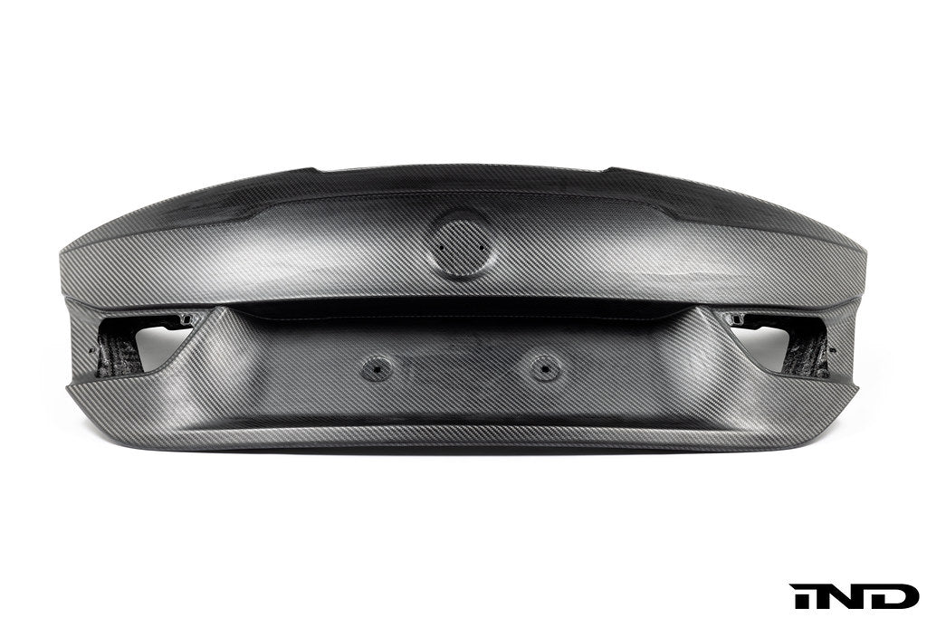 RKP Alpha-N F82 M4 carbon trunk exterior part on a white background, showcasing sleek carbon fiber design and precision fit.