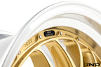 Close-up view of the new black emblem on a gold BBS RT-88 wheel that shows the wheel part number and size specs.