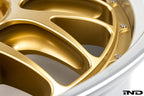 Close-up view of the pocketed spokes, hardware, and rim edge on the BBS RT-88 forged aluminum wheel in a gold center finish.