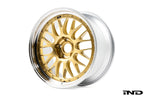 3/4 front view of one of BBS' RT-88 wheels showing a gold multi-spoke center and Black Bright Diamond-Cut outer rim against a white background.