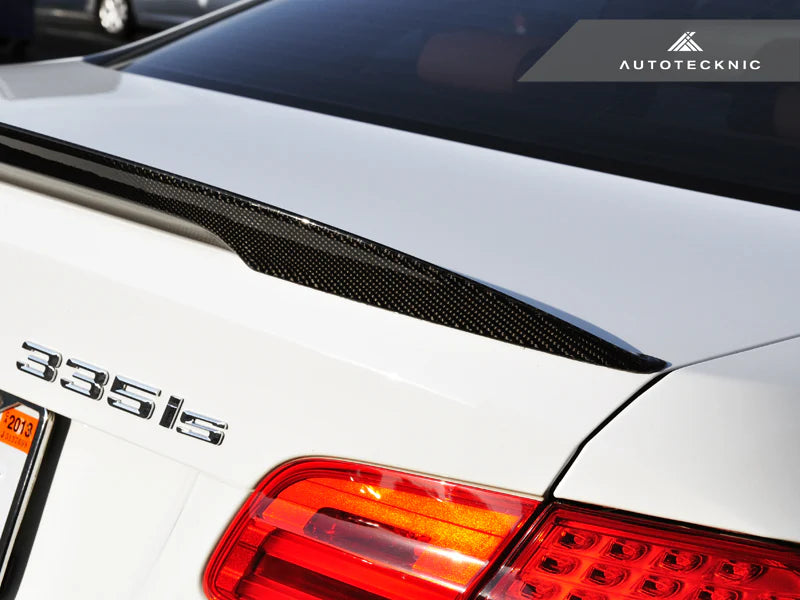 AutoTecknic E92 M3 Carbon Performante trunk spoiler mounted on a BMW E92 M3's exterior, showcasing its sleek carbon fiber design.
