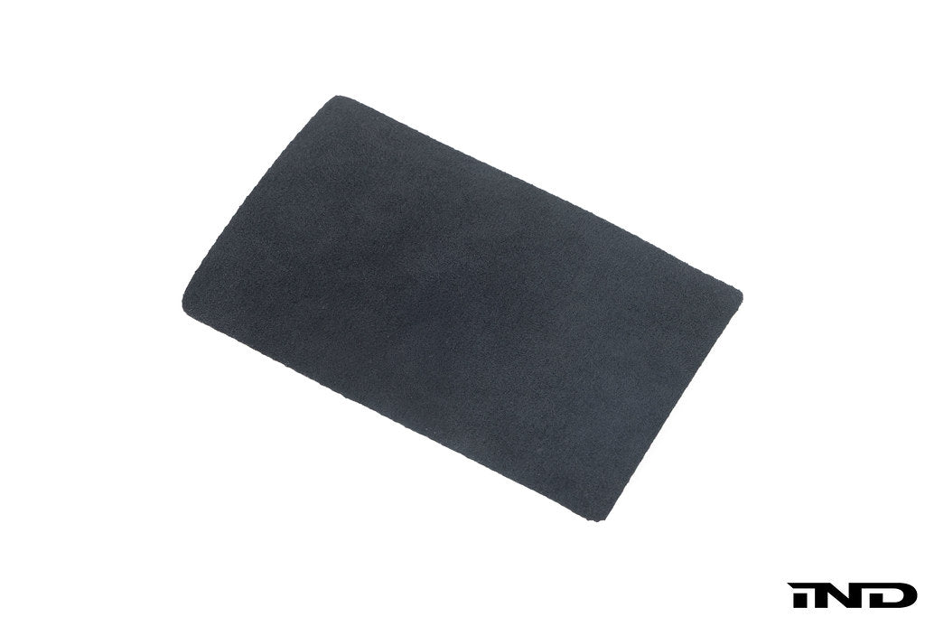 Close-up of a BMW E46 M3 CSL interior center console with a black Alcantara pad for a sleek, sporty look.