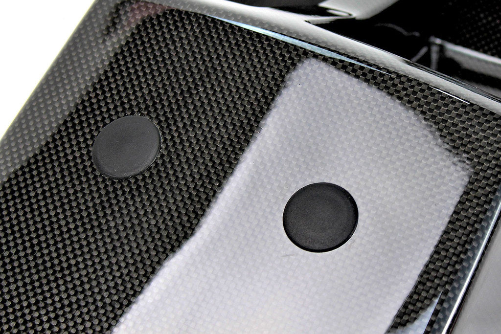 Installed IND E46 M3 CSL center console trim kit with black blind plugs on BMW E46 M3 interior for a sleek, finished look.