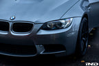 IND Painted Front Reflector Set installed on a BMW E90, E92, or E93 M3 in Space Gray Metallic (A52), replacing the factory amber reflectors with OEM color-matched genuine BMW reflector cores.