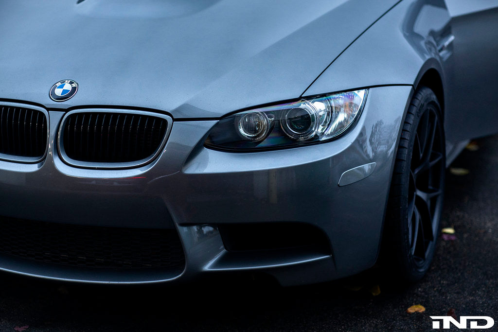 IND Painted Front Reflector Set installed on a BMW E90, E92, or E93 M3 in Space Gray Metallic (A52), replacing the factory amber reflectors with OEM color-matched genuine BMW reflector cores.
