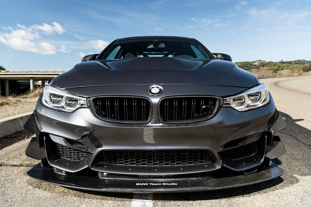 IND Carbon Fiber Front Grille Set installed on a BMW F80 M3 / F82 M4 showcasing 2x2 carbon fiber surrounds with OEM BMW grille slats and OEM-plus fitment.
