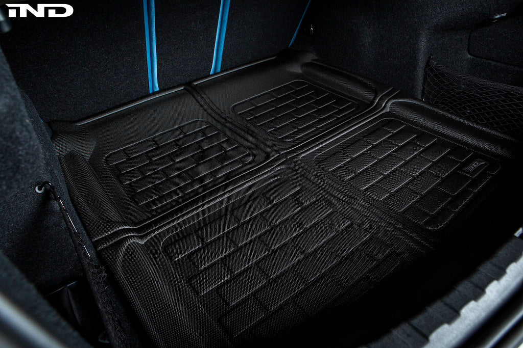 3D MAXpider G80 M3 all-weather cargo mat inside vehicle showing textured rubber surface and raised edges for protection.