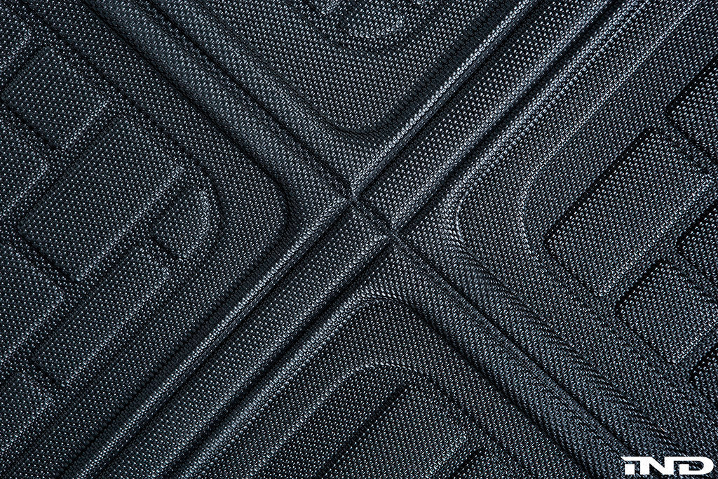 3D MAXpider G80 M3 all-weather cargo mat inside vehicle showing textured rubber surface and raised edges for cargo protection.