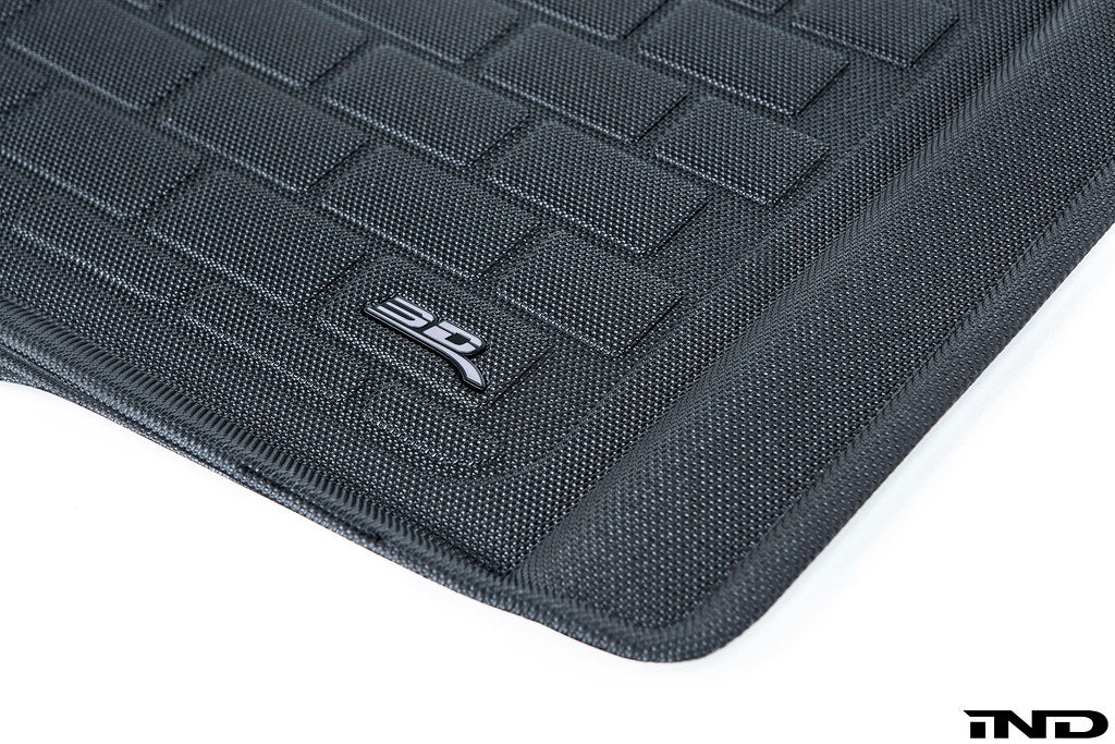 3D MAXpider G80 M3 All-Weather Cargo Mat interior view showing textured rubber surface and raised edges for vehicle cargo protection.
