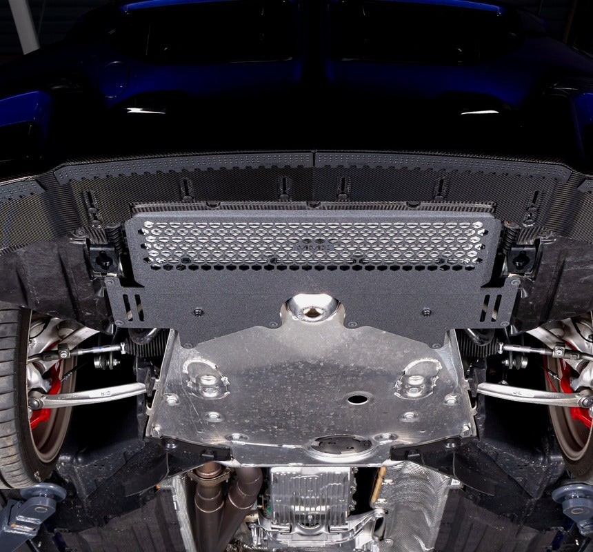 Mobile hero image of the MMX Performance oil cooler guard installed on a BMW G87 M2 CS, highlighting the lightweight aluminum underbody protection and optimized airflow design for the S58 engine.