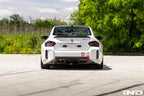 BMW G87 M2 Racing with Acexxon Rear Reflector Insert Set installed, showing the horizontal rear bumper inserts for an OEM+ appearance.